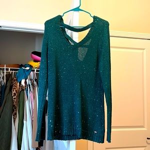 Guess festive sparkly green sweater would go great with leggings